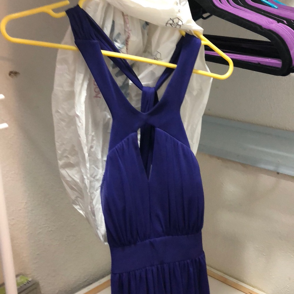 Purple prom dress with low back design